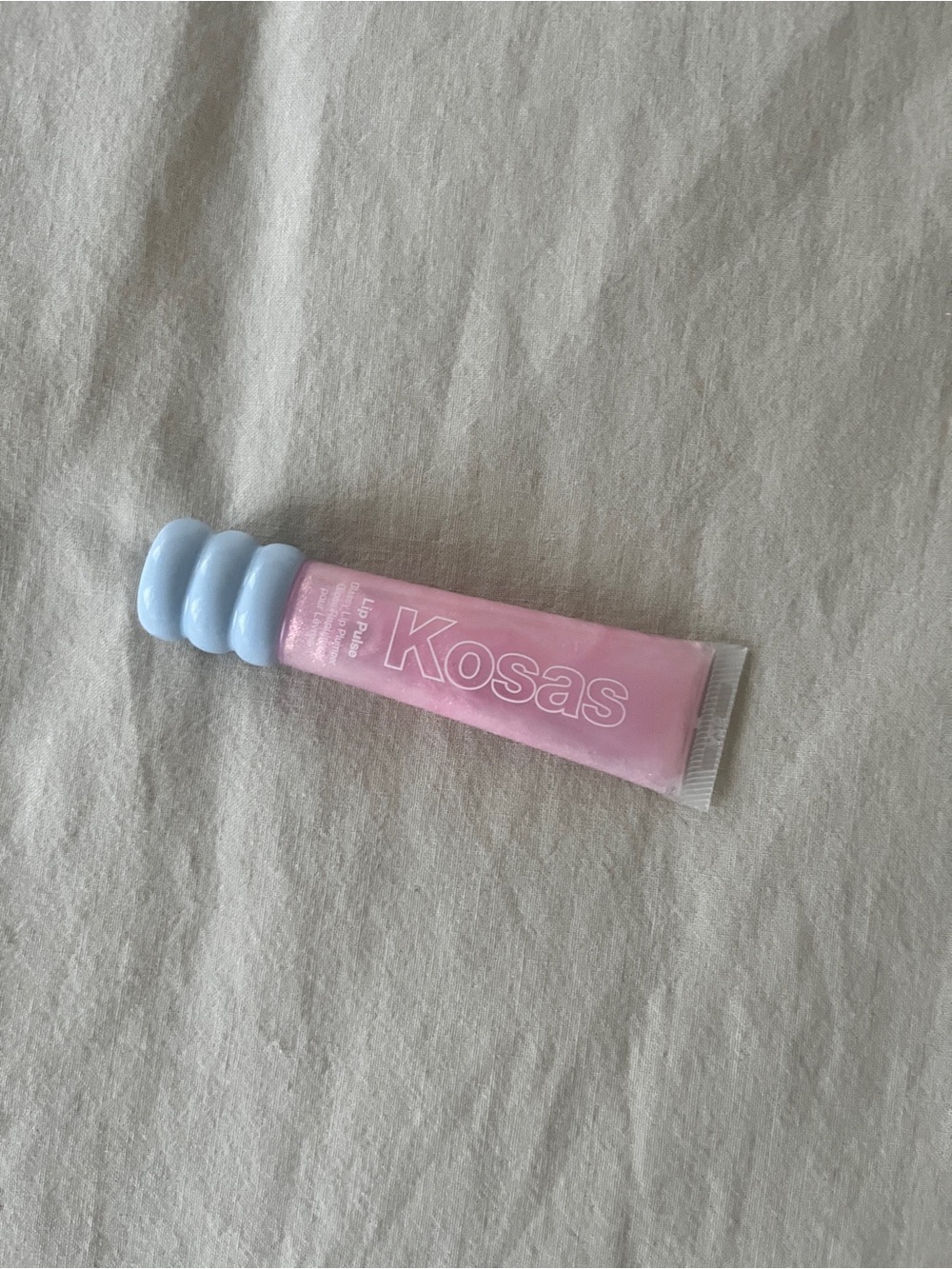 Kosas Lip Pulse Glassy Lip Plumper Gloss in “aura flare”